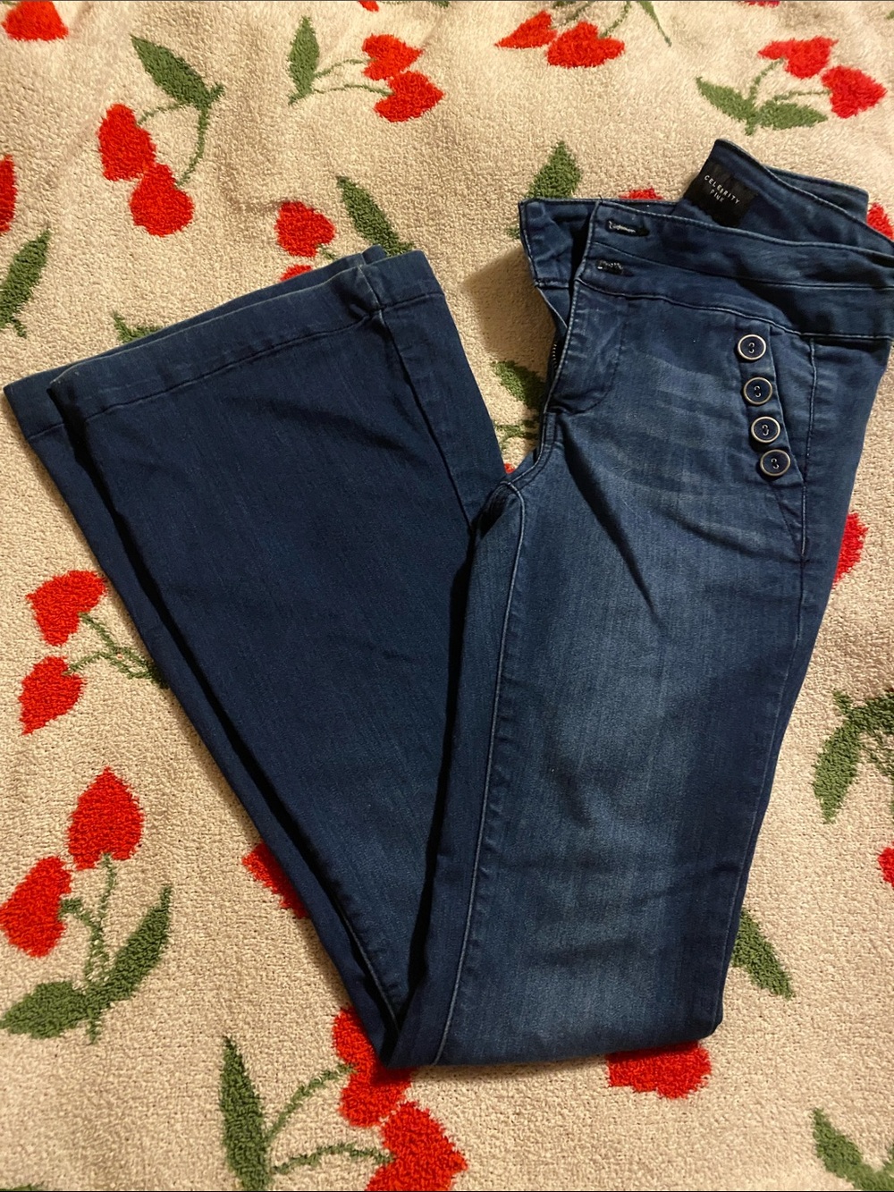 Celebrity pink high waisted sailor flare jeans.
